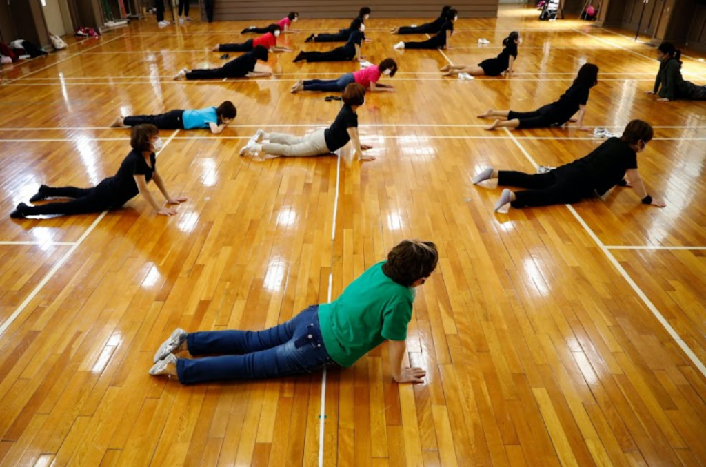 The squad warms up before every practice session.