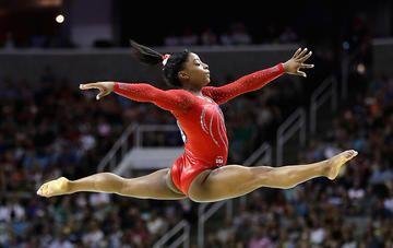 Biles performing gymnastics.